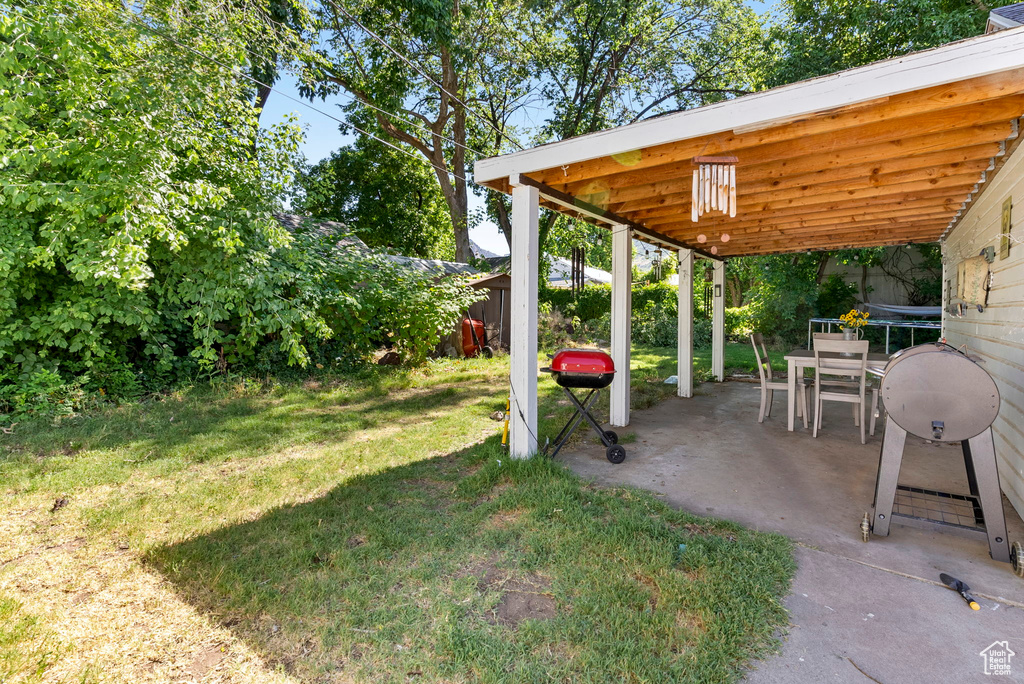 View of yard with a patio area