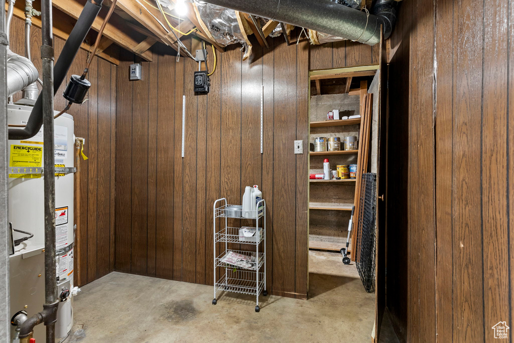 Basement with wood walls and water heater