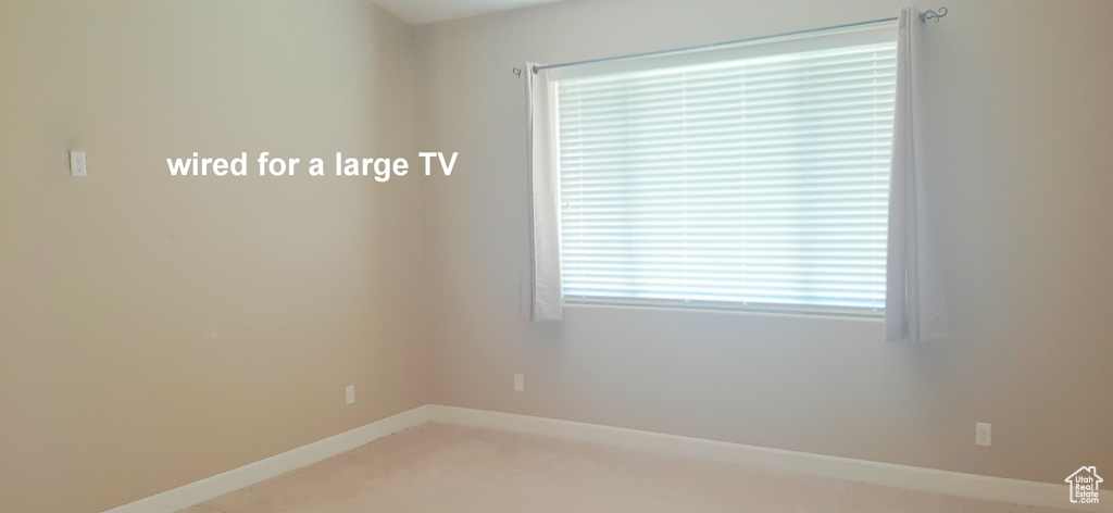 Unfurnished room featuring carpet flooring