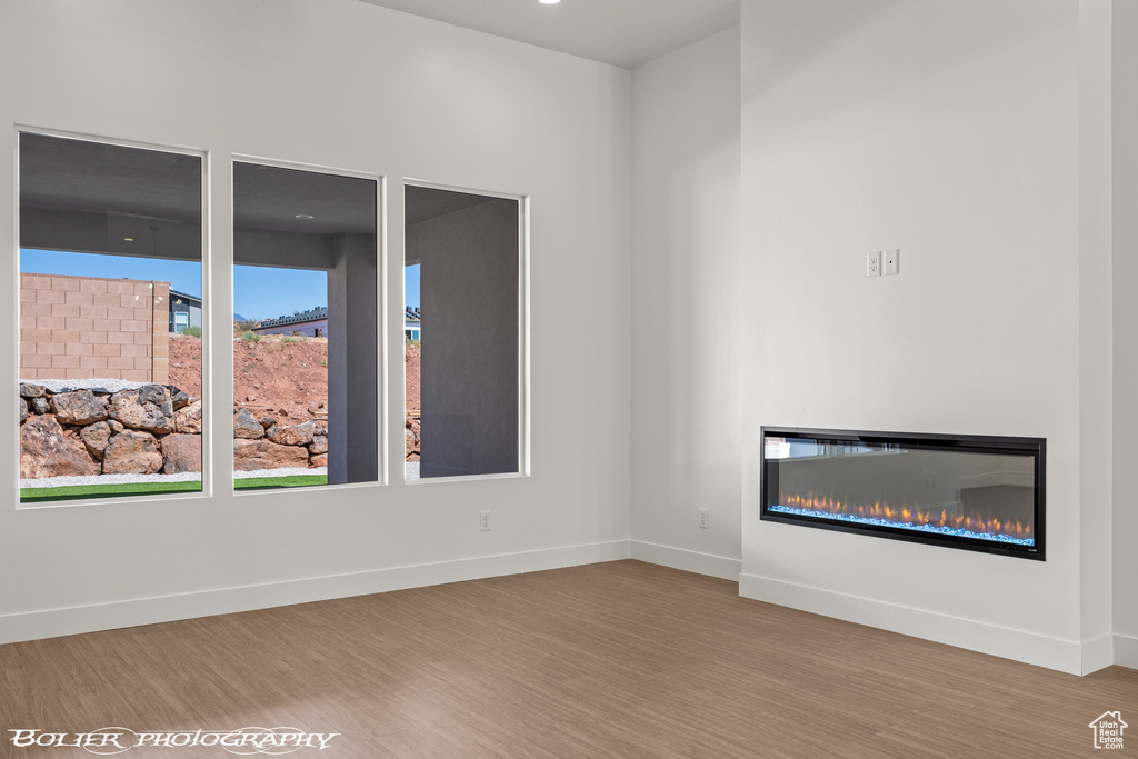 Unfurnished living room featuring hardwood / wood-style flooring