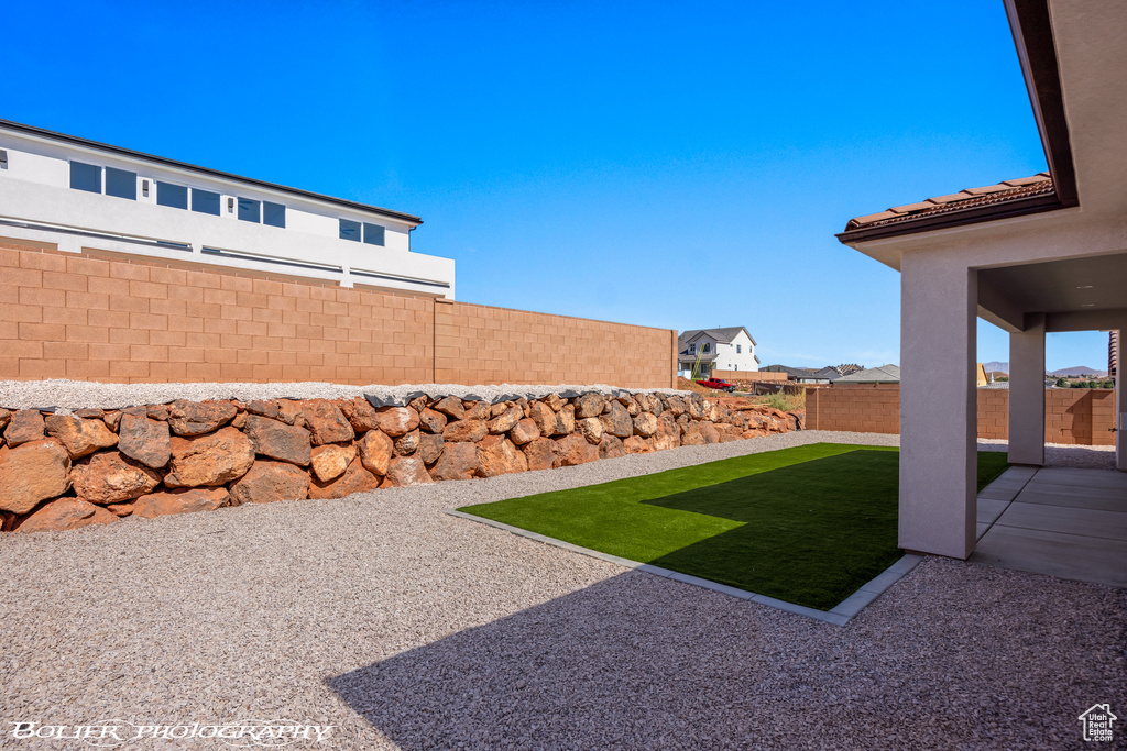 View of yard with a patio area