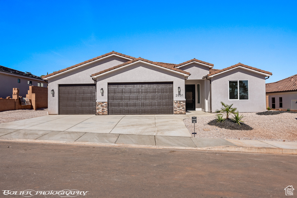 View of front of property featuring a garage