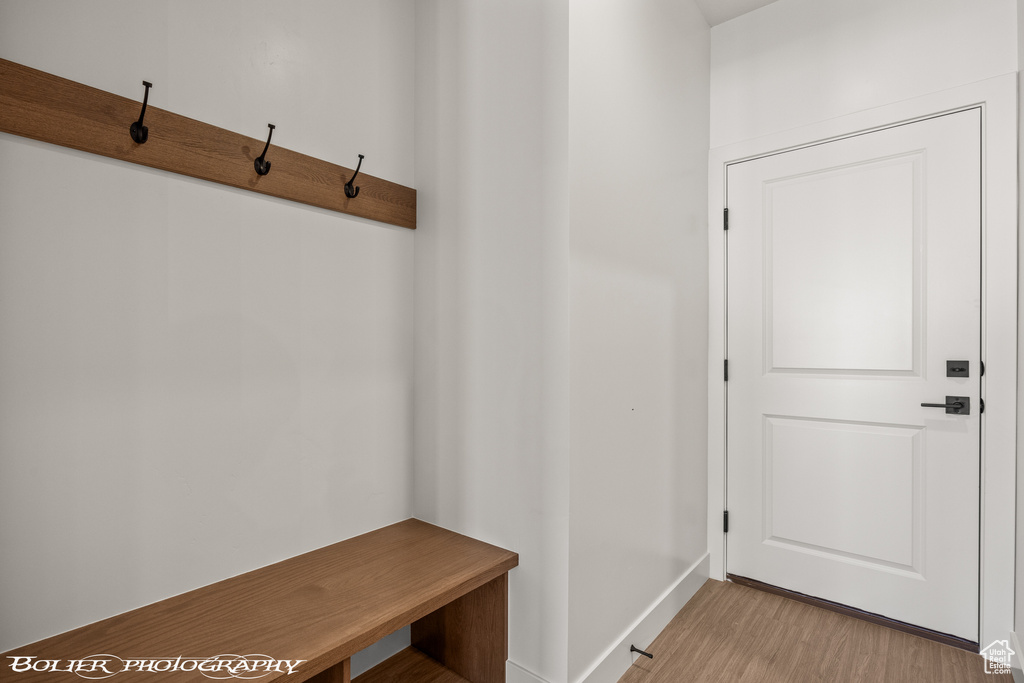 Mudroom with light hardwood / wood-style flooring