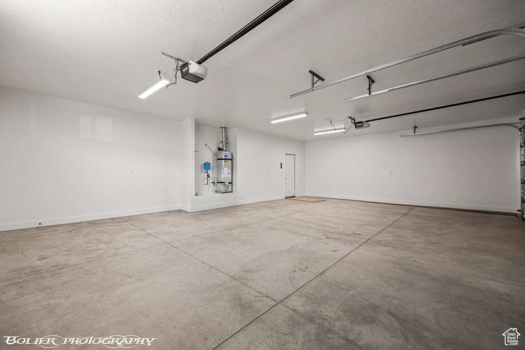 Garage with a garage door opener and water heater