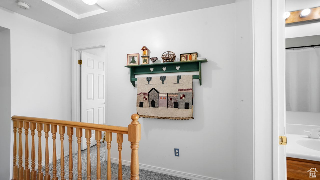 Interior space featuring sink and carpet