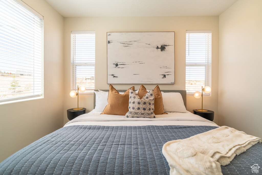 Bedroom featuring multiple windows