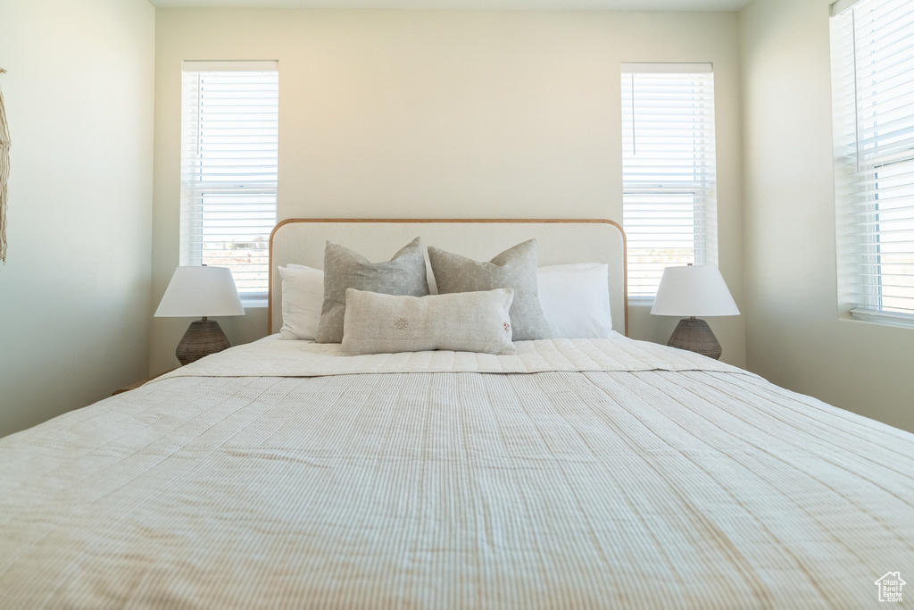 Bedroom with multiple windows