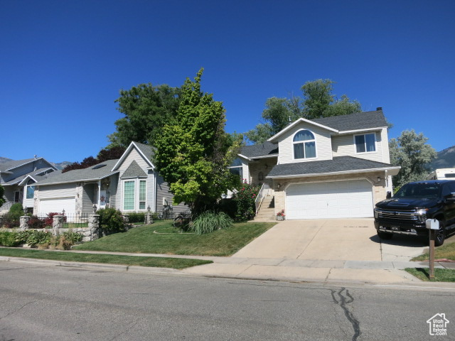 View of front of property featuring a garage