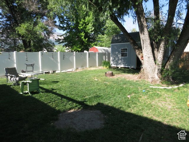 View of yard with a shed