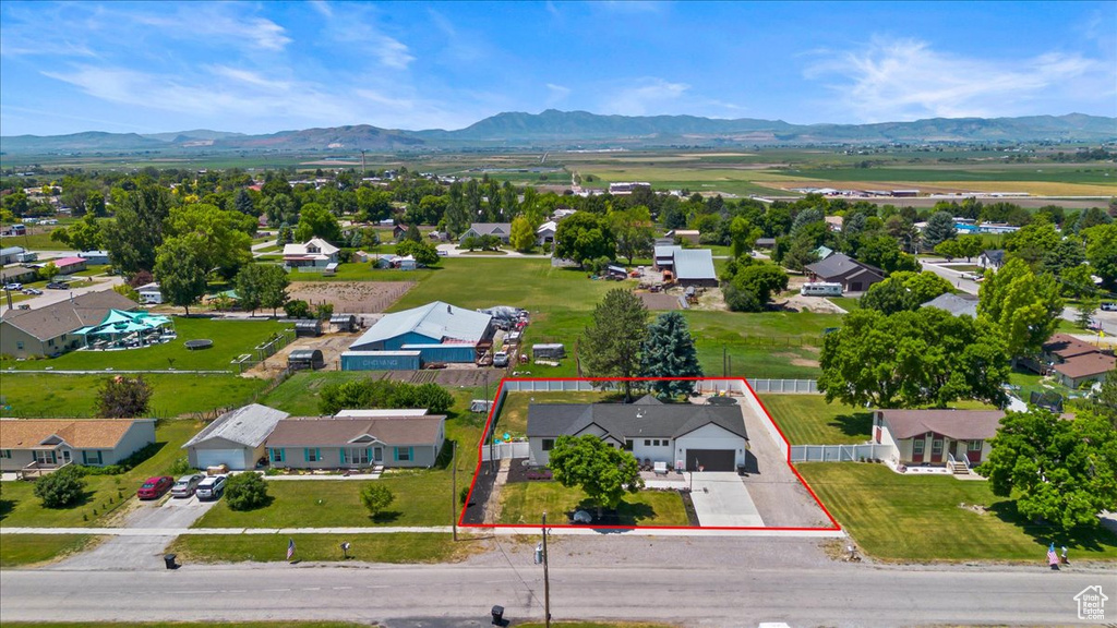 Birds eye view of property with a mountain view