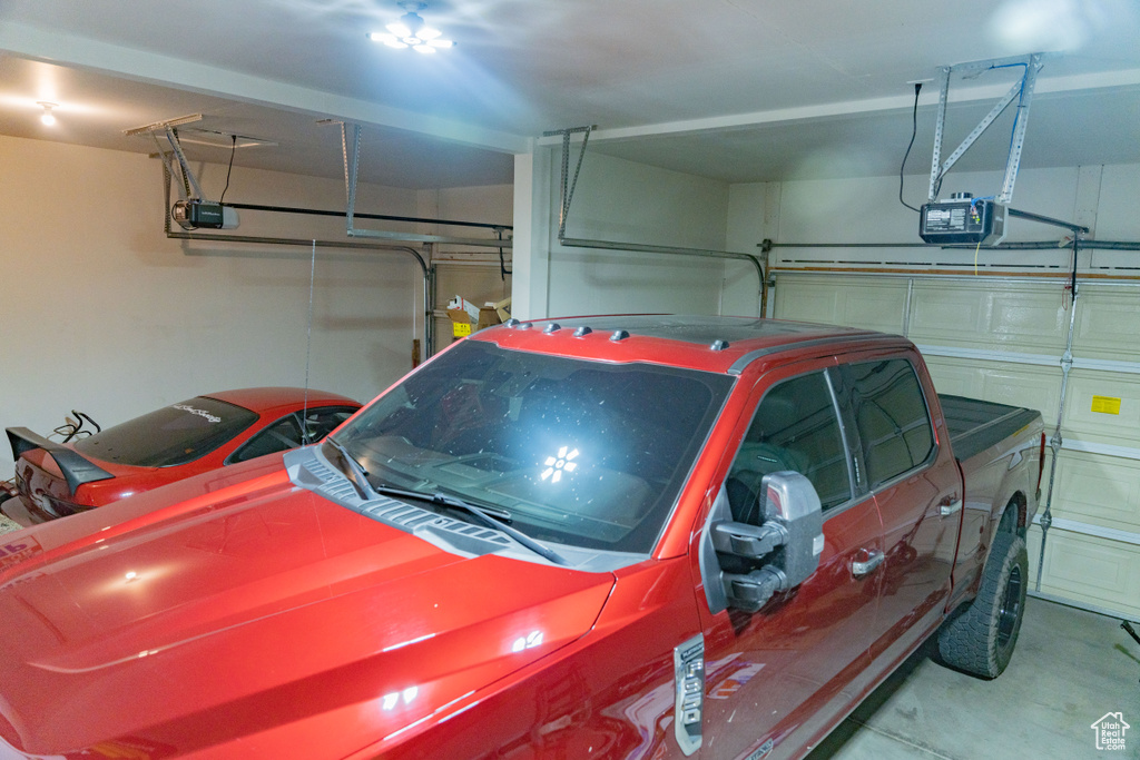 Garage featuring a garage door opener