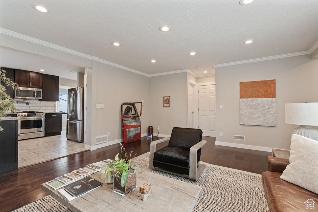 Tiled living room featuring ornamental molding