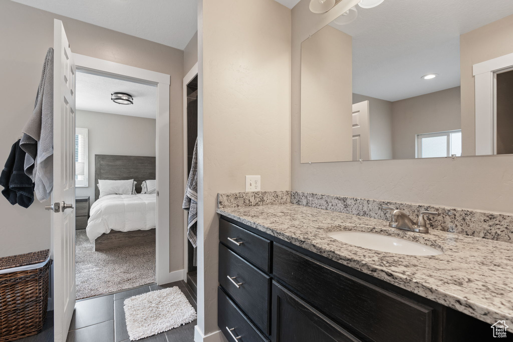 Bathroom with tile flooring and oversized vanity