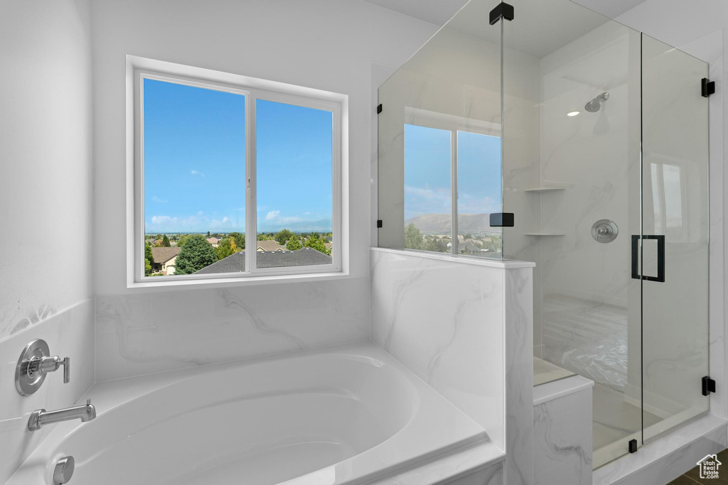 Bathroom featuring separate shower and tub