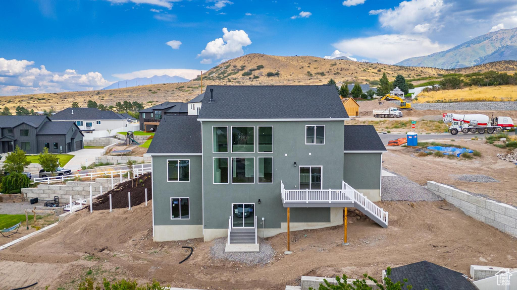 Rear view of house with a mountain view