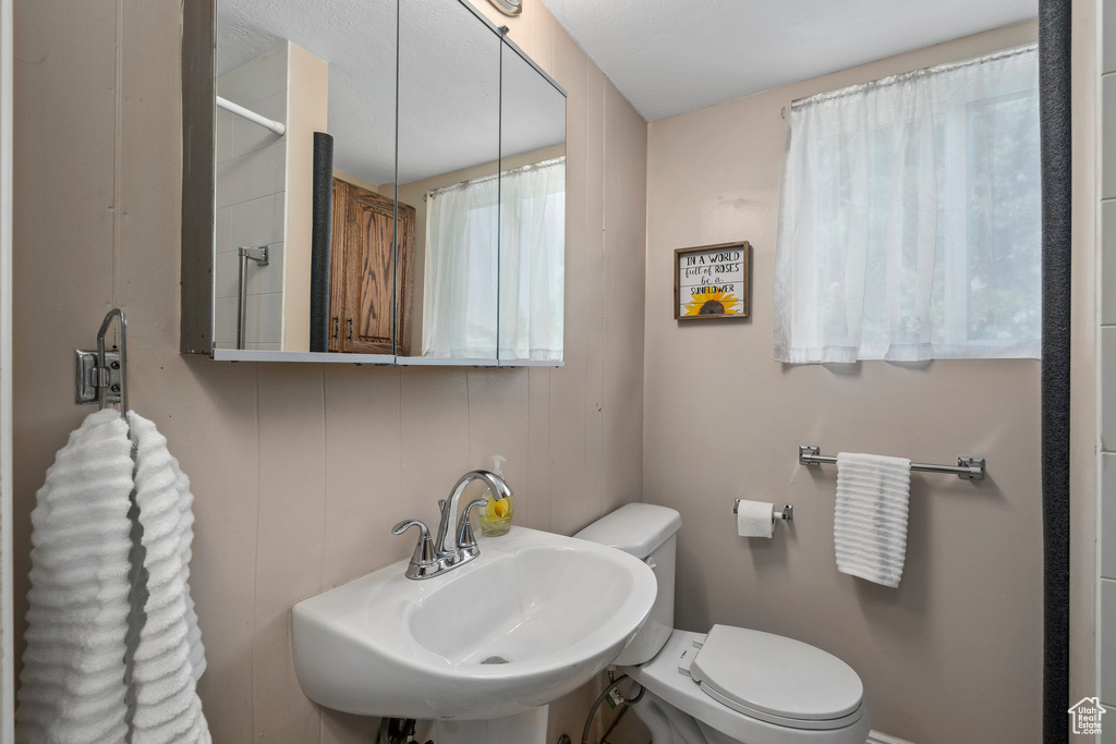 Bathroom with sink and toilet