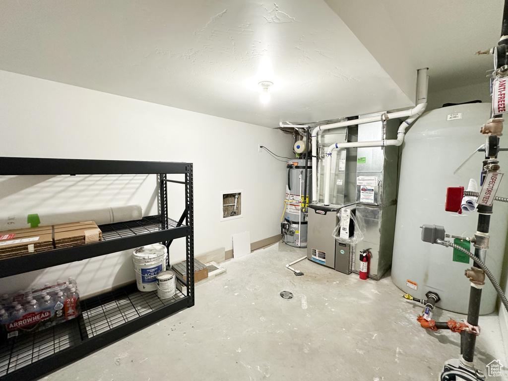 Interior space featuring heating utilities and water heater