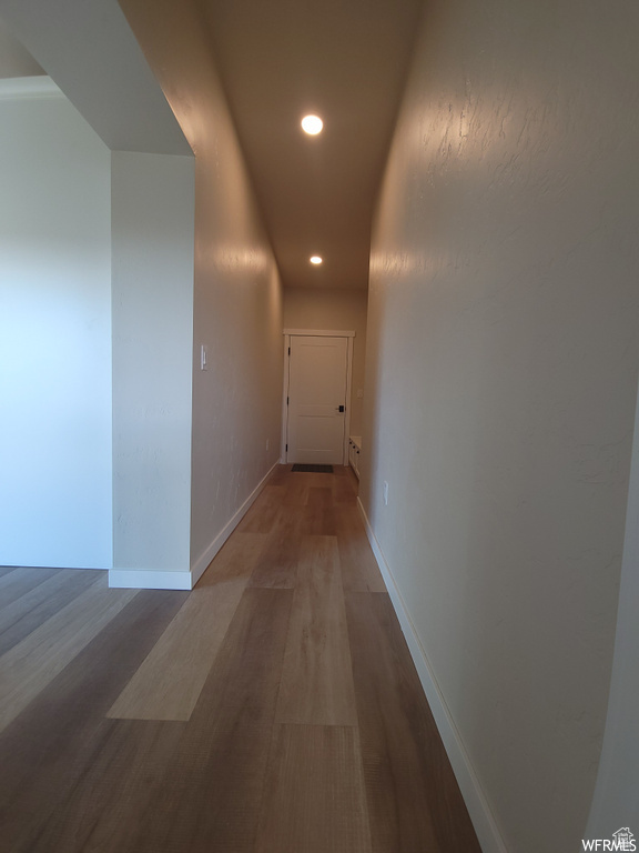 Corridor featuring hardwood / wood-style floors