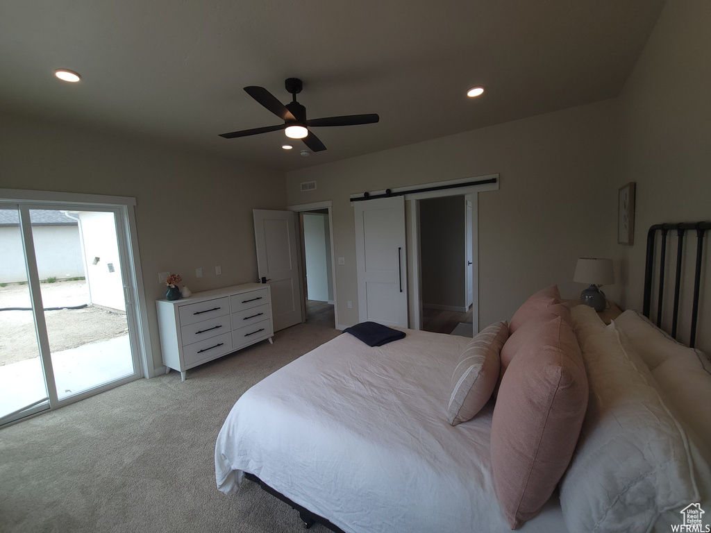 Carpeted bedroom featuring ceiling fan and access to outside