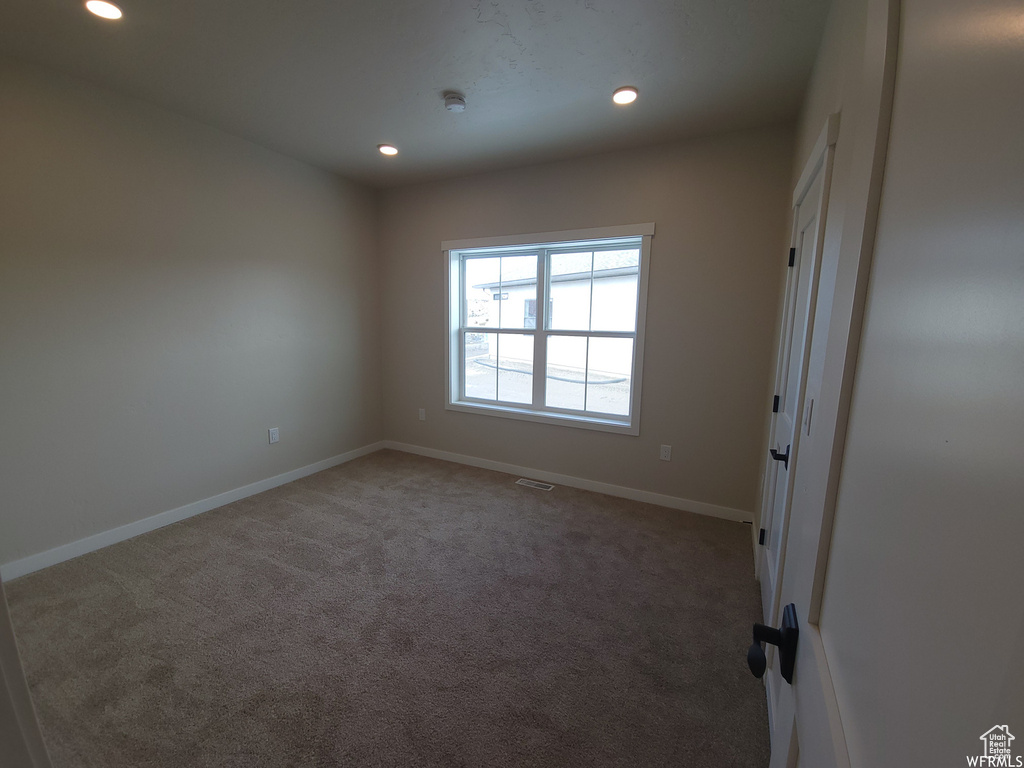 View of carpeted spare room