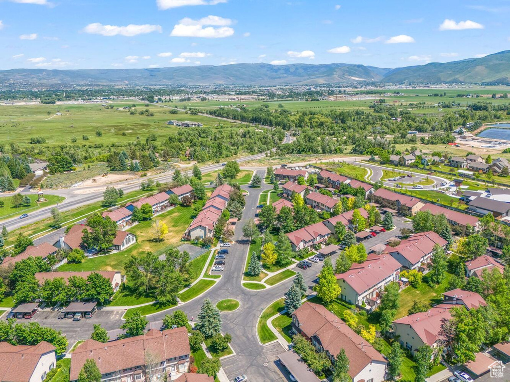 Birds eye view of property with a mountain view