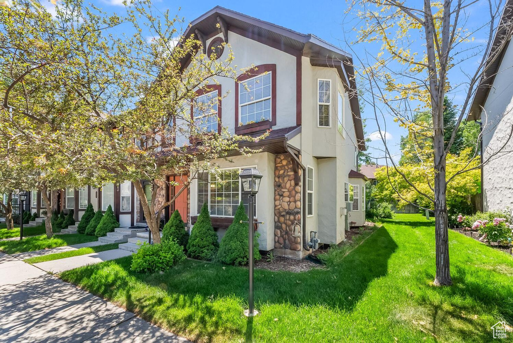 View of front of property with a front lawn