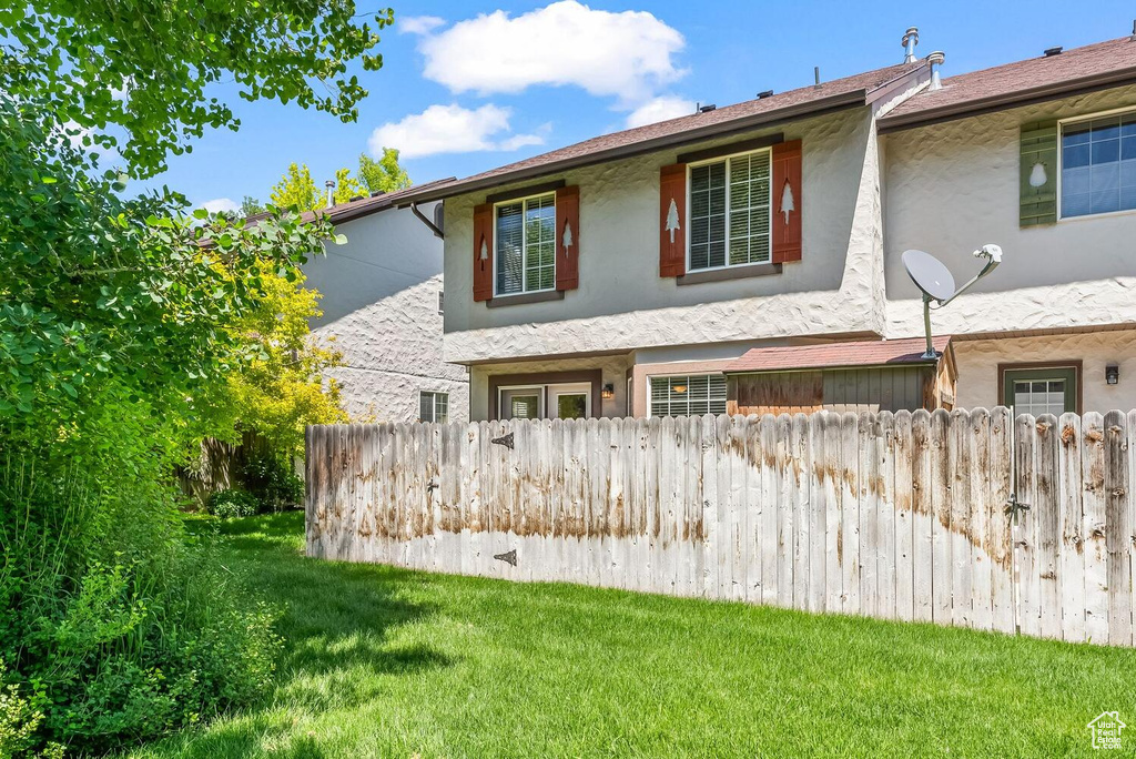 View of front of property with a front lawn