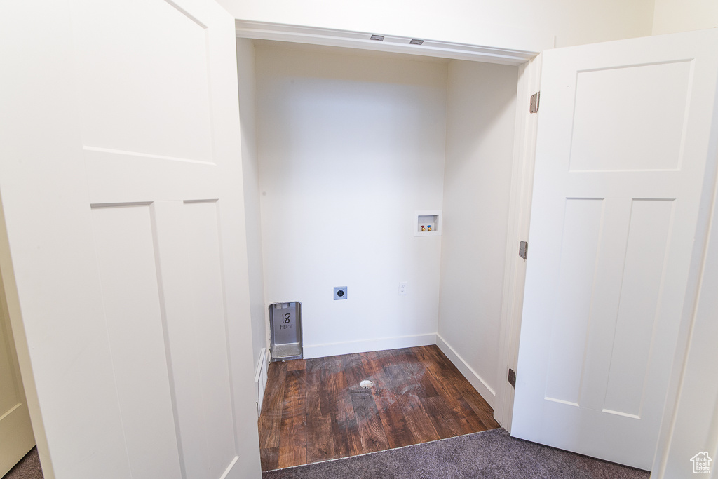 Washroom with electric dryer hookup, hardwood / wood-style floors, and hookup for a washing machine