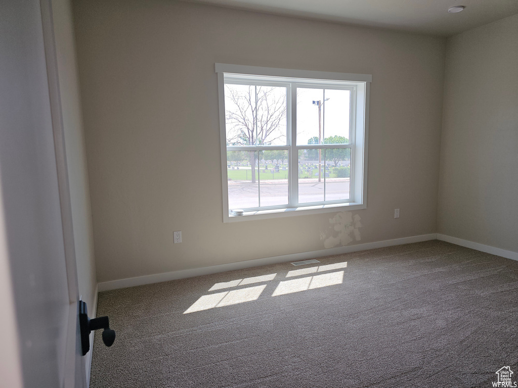 Empty room featuring carpet floors