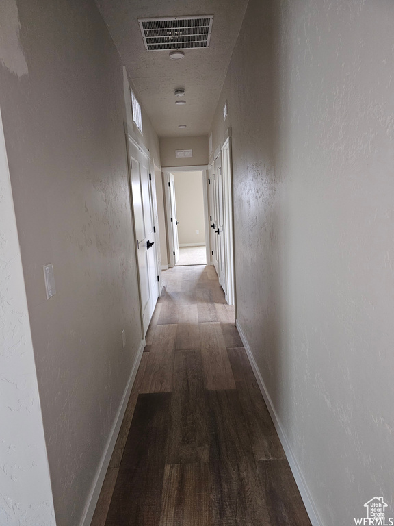 Hallway featuring wood-type flooring