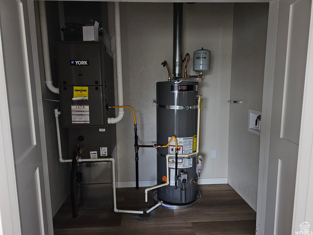 Utility room featuring secured water heater