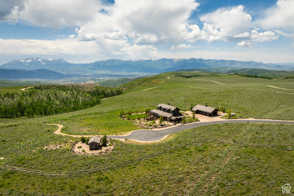 View of mountain backdrop featuring rural landscape