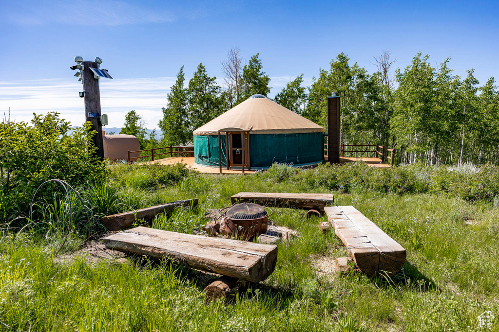 View of yard with a fire pit