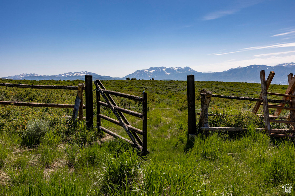 View of mountain backdrop with rural landscape