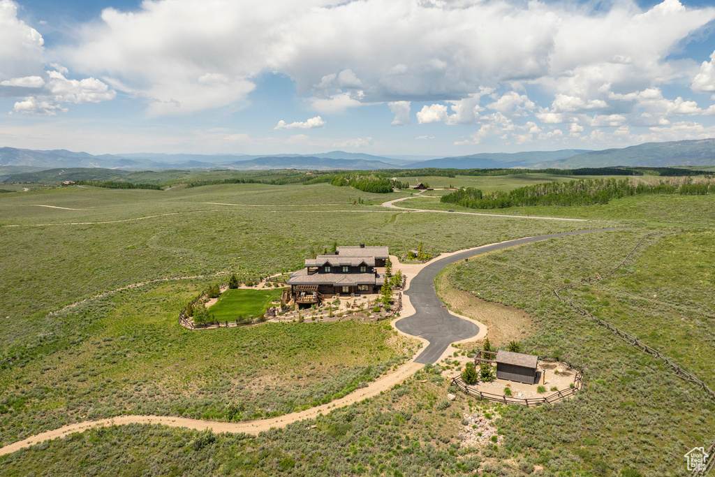 Aerial view of sparsely populated area featuring a mountain backdrop
