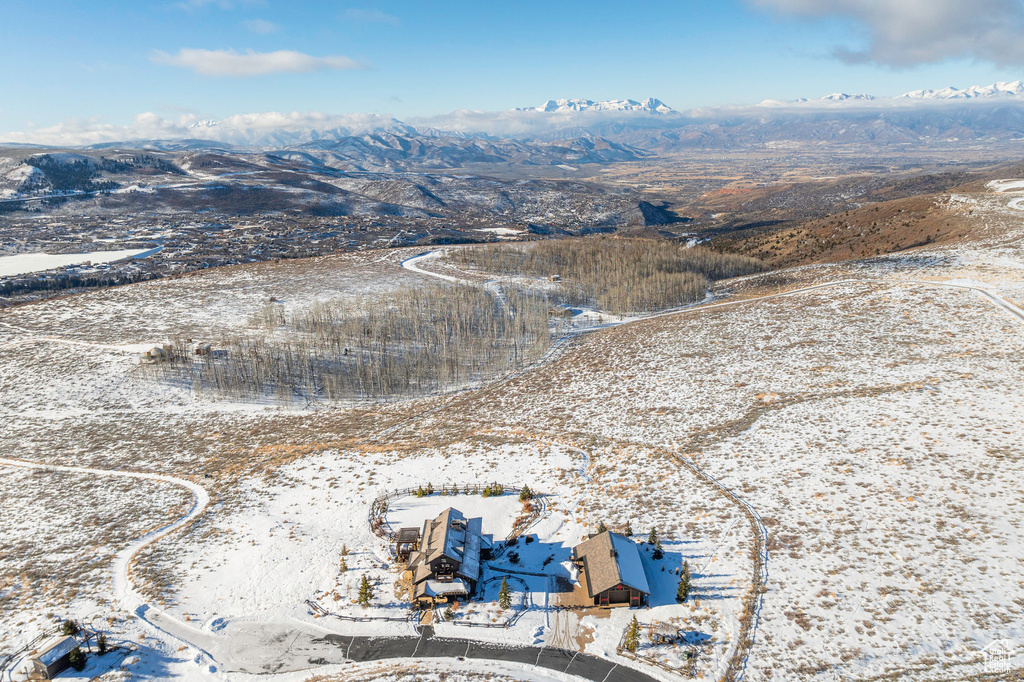Snowy aerial view featuring a mountain view