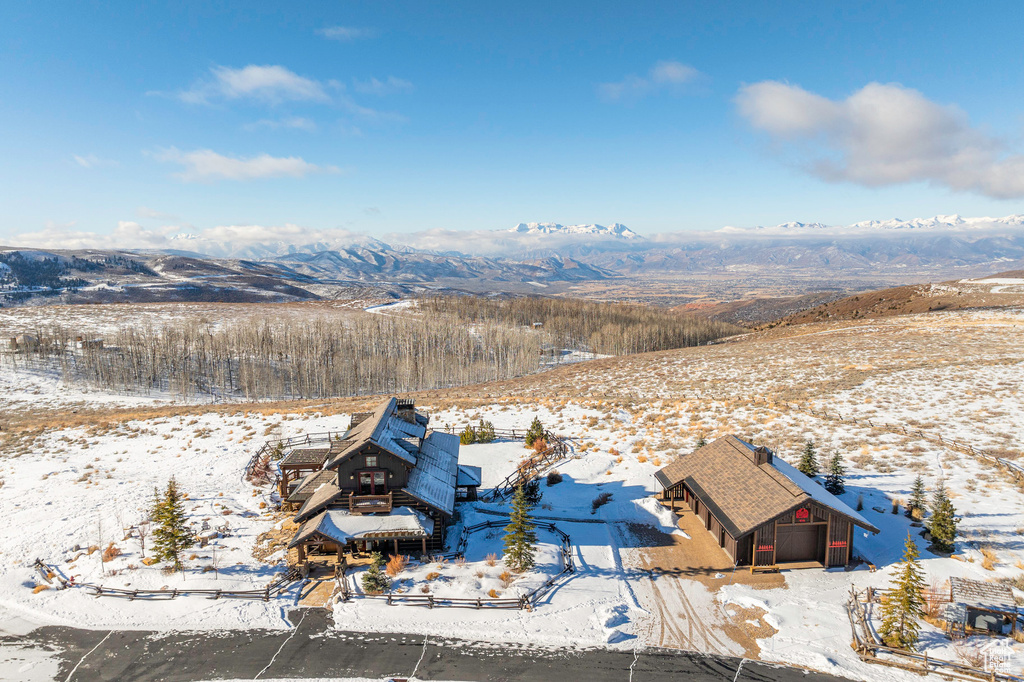 Snowy aerial view with a mountain view