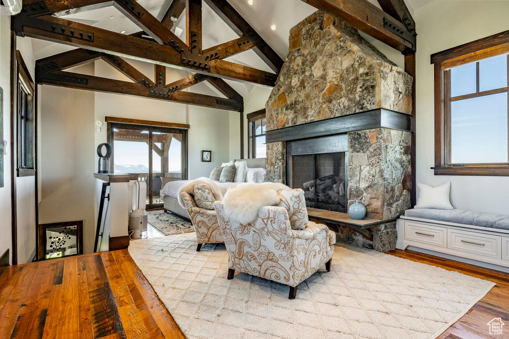 Living room featuring wood finished floors, a fireplace, and recessed lighting