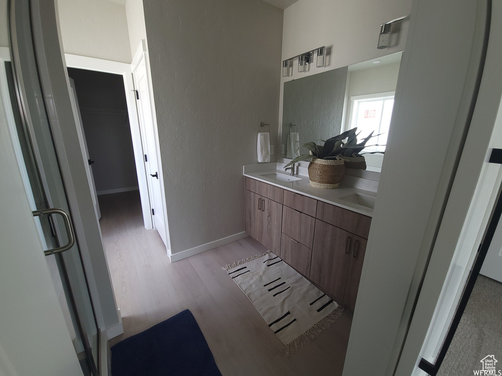 Bathroom with wood-type flooring and vanity