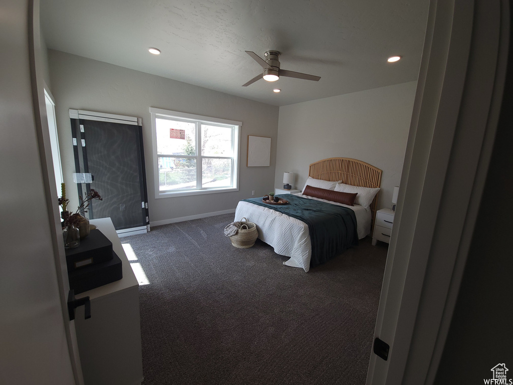 Carpeted bedroom with ceiling fan