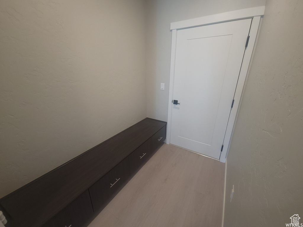 Mudroom with light hardwood / wood-style flooring