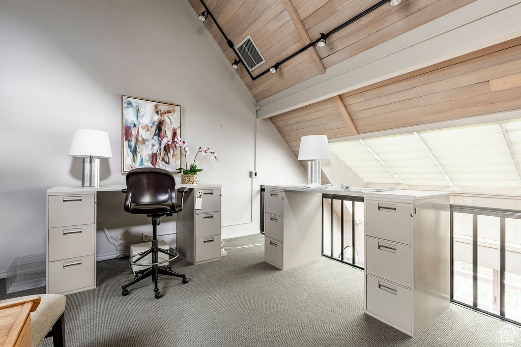 Office space with carpet, lofted ceiling with beams, and wood ceiling