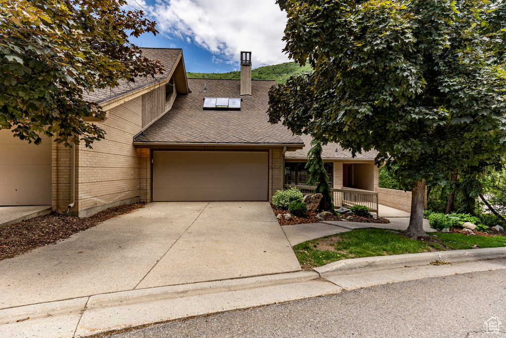 View of front facade featuring a garage