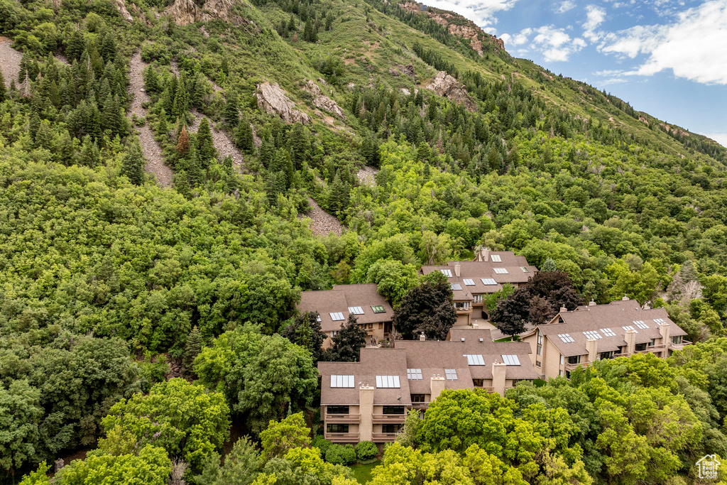 Birds eye view of property with a mountain view