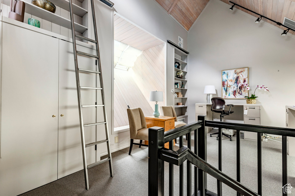 Carpeted home office featuring wooden ceiling and vaulted ceiling