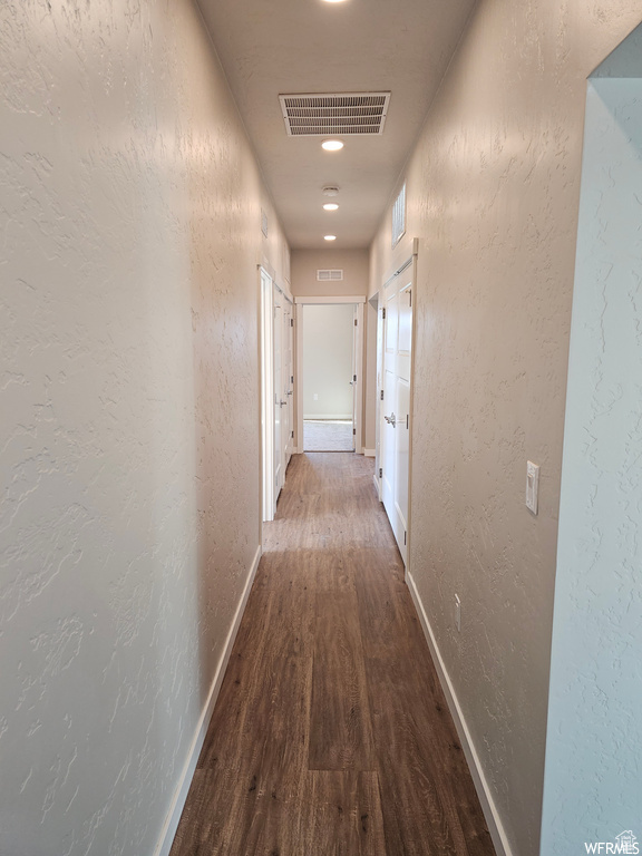 Corridor featuring hardwood / wood-style flooring