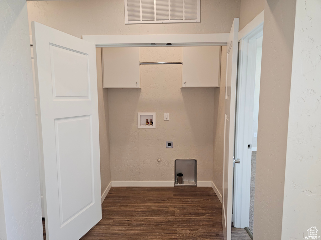 Laundry room featuring washer hookup, electric dryer hookup, and dark wood-type flooring