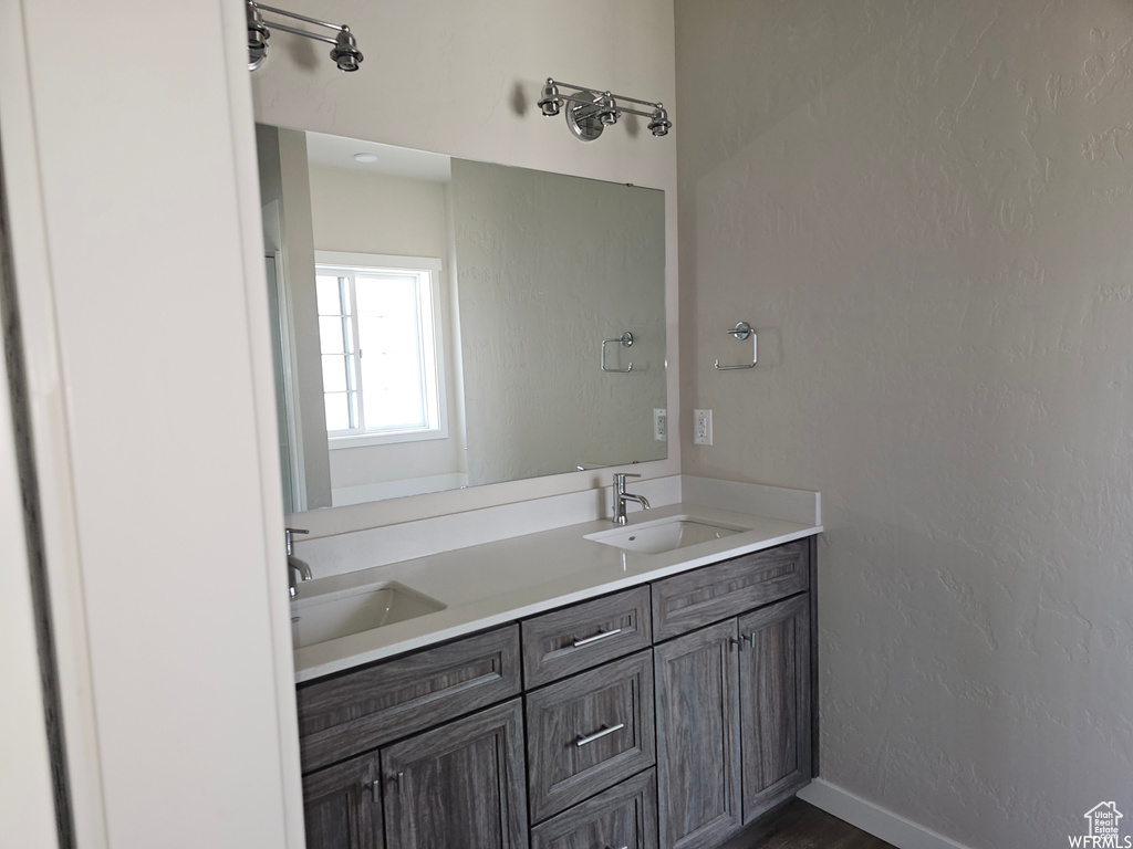 Bathroom with dual sinks and oversized vanity