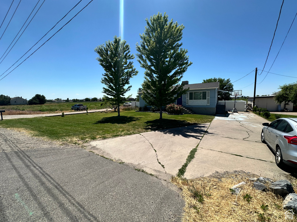 View of front of property with a front yard