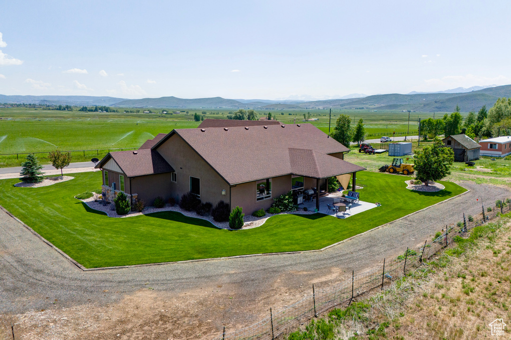 Birds eye view of property with a mountain view